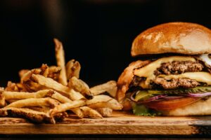 burger and fries - fast food consumption links to obesity